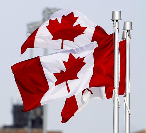 Flags fly at the CMHR on the 50th anniversary of our current Canadian Flag, Sunday, February 15, 2015. (TREVOR HAGAN/WINNIPEG FREE PRESS)