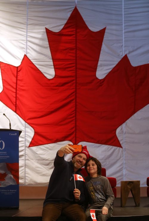 A flag raising event at the CMHR on the 50th anniversary of our current Canadian Flag, Sunday, February 15, 2015. (TREVOR HAGAN/WINNIPEG FREE PRESS)