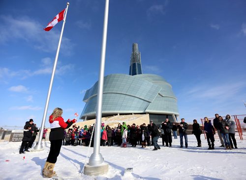 Minister Shelly Glover participates in a flag raising event at the CMHR on the 50th anniversary of our current Canadian Flag, Sunday, February 15, 2015. (TREVOR HAGAN/WINNIPEG FREE PRESS)