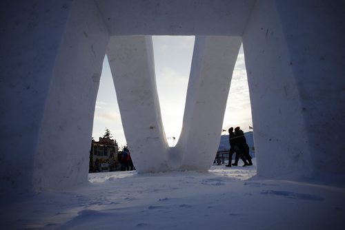 February 15, 2015 - 150215  -  Festival goers walk past a snow sculpture at The Festival du Voyageur Sunday, February 15, 2015.  John Woods / Winnipeg Free Press