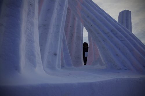 February 15, 2015 - 150215  -  Festival goers walk past snow sculpture Arctic Morning by team Sweden at The Festival du Voyageur Sunday, February 15, 2015.  John Woods / Winnipeg Free Press
