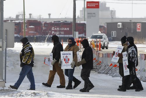 February 15, 2015 - 150215  -  CP Rail workers walk the picket line at Winnipeg rail yard on McPhillips Sunday, February 15, 2015.  John Woods / Winnipeg Free Press