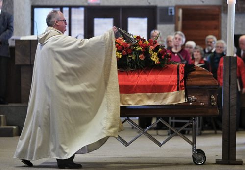 Father Marcel Carrière presides over the funeral for Augustine Abraham a great niece to Louis Riel the Metis leader and Father of Confederation at the St. Boniface Cathedral Monday morning on Louis Riel Day.   150216 February 16, 2015 Mike Deal / Winnipeg Free Press