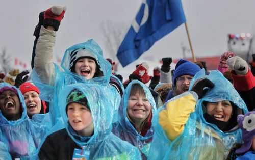 Crowds get boisterous during the making of the largest living Métis flag ever on the grounds of the Festival du Voyageur Monday afternoon on Louis Riel Day.   150216 February 16, 2015 Mike Deal / Winnipeg Free Press