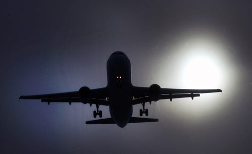 A jet comes in for a landing at James A Richardson International airport in Winnipeg Tuesday through ice crystals and light fog Standup Photo - Feb 17, 2015   (JOE BRYKSA / WINNIPEG FREE PRESS)