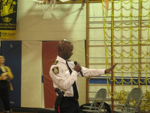 Canstar Community News Feb. 10, 2015 - Winnipeg police chief Devon Clunis spoke to the kids at Hampstead School before an I Love to Read event in the school gym. (SHELDON BIRNIE/CANSTAR COMMUNITY NEWS/HERALD).