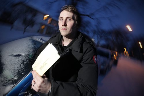 February 17, 2015 - 150217  -  Kristjan Thompson received a parking ticket Friday for parking on his street during a snow parking ban but his car was towed 8 blocks away and he couldn't find it until Tuesday. Thompson is photographed on his West Kildonan street Tuesday, February 17, 2015. John Woods / Winnipeg Free Press