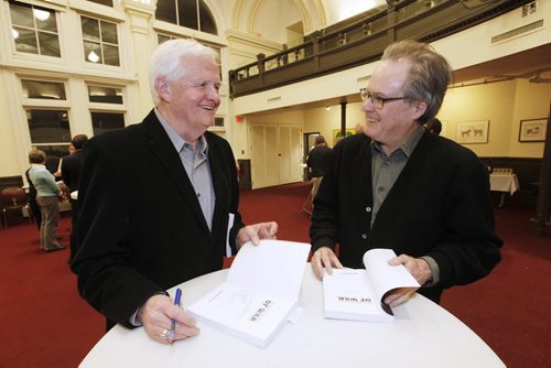 February 17, 2015 - 150217  -  University of Winnipeg history professor Robert Young signs a book for his colleague James Hanley at the launch of his book Premonitions of War: The Winnipeg Free Press And The Hitler Years  Tuesday, February 17, 2015. John Woods / Winnipeg Free Press