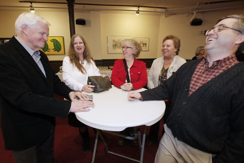 February 17, 2015 - 150217  -  University of Winnipeg history professor Robert Young (L) talks with former students Suzanne Martin, Patty Hawkins, Marion Tetrault and Don Macri at the launch of his book Premonitions of War: The Winnipeg Free Press And The Hitler Years  Tuesday, February 17, 2015. John Woods / Winnipeg Free Press