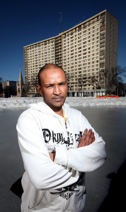 Said Ali poses in a frigid foreign environment Wednesday. He came from Somalia and had to adjust to the cold. He found indoor activities like soccer. See Carol Sanders story. February 18, 2015 - (Phil Hossack / Winnipeg Free Press)