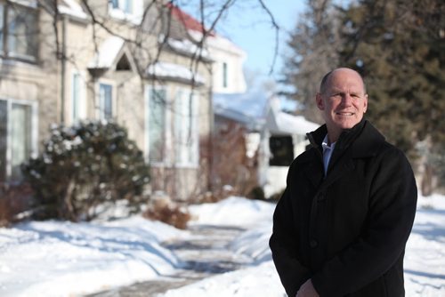 Winnipeg Realtors Association president David Mackenzie in front of street scape of homes along Lydale Drive for story on affordable housing in Manitoba. See Murray McNeil story.  Feb 18, 2015 Ruth Bonneville / Winnipeg Free Press