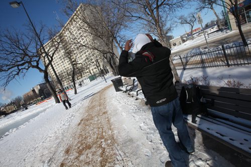 SHOT FROM BEHIND ANONYMOUS IMAGE FOR ILLUSTRATION--Said Ali poses in a frigid foreign environment Wednesday. He came from Somalia and had to adjust to the cold. He found indoor activities like soccer. See Carol Sanders story. February 18, 2015 - (Phil Hossack / Winnipeg Free Press)
