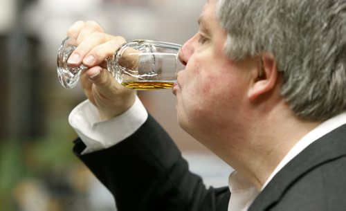 Ent./Uptown.  Gary Dawyduk tastes the sample of Knob Creek straight bourbon whiskey. For feature with Gary Dawyduk, Liquor Marts product ambassador and Ben tasting and talking about different whiskies at the Grant Park Liquor Mart in their education centre.  Ben MacPhee-Sigurdson  story Wayne Glowacki/Winnipeg Free Press Feb.18   2015