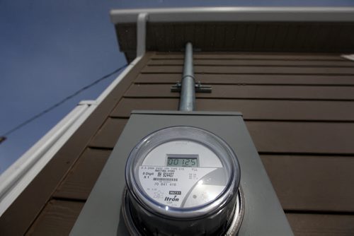 Manitoba Hydro meters on the side of a newly built homes powered by geothermal energy in Peguis First nation.  Feature story on how sustainable energy sources like  geothermal and solar are being implemented on First Nation reserves like Peguis and Fisher River and its positive impact on the people and our province.   See Alex Paul story.   Feb 17, 2015 Ruth Bonneville / Winnipeg Free Press