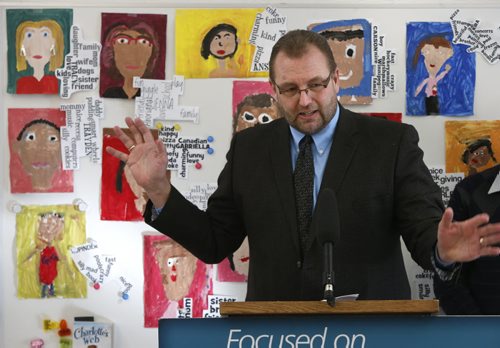 Education and Advanced Learning Minister Peter Bjornson makes an announcement in front of art work by students at  Amber Trails Community School that the Manitoba Gov't will continue to create smaller classes for students in Kindergarten-grade3 by providing an additional $3 million in new funding for schools. see Bruce Owen Story.   Wayne Glowacki/Winnipeg Free Press Feb.19   2015