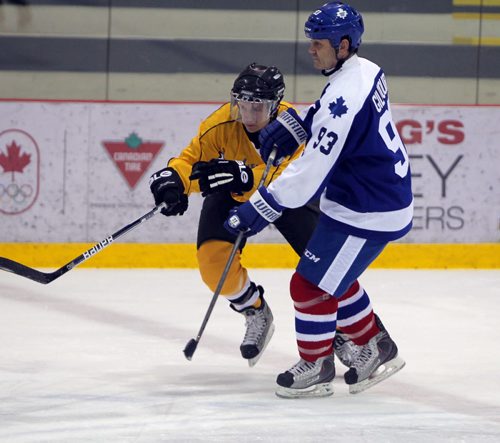 SPORTS/LOCAL/BIZ - The Mike Keane Celebrity Hockey Classic, held this year on February 18 and 19, 2015 at MTS Iceplex. Right, former NHL star Doug Gilmour battles with the opposing team member during the event. BORIS MINKEVICH/WINNIPEG FREE PRESS FEB. 19, 2015