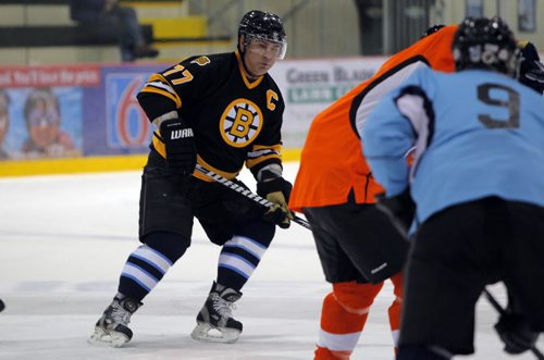 SPORTS/LOCAL/BIZ - The Mike Keane Celebrity Hockey Classic, held this year on February 18 and 19, 2015 at MTS Iceplex. Former NHL star Ray Bourque battles during the event. BORIS MINKEVICH/WINNIPEG FREE PRESS FEB. 19, 2015