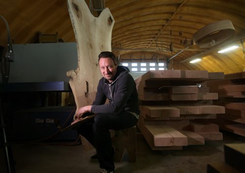 Story: J. Neufeld,  Local wood artist and owner of Wood Anchor, recently made a  large, oak table that was shipped to Canada House.    See Story.  Feb 19, 2015 Ruth Bonneville / Winnipeg Free Press