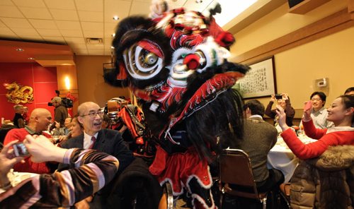 Lion Dancers mover through the room at the beginning of the Chinese New Year Banquet at the Kum Koon Garden restaurant.  150219 February 19, 2015 Mike Deal / Winnipeg Free Press