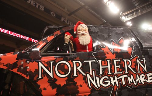 Free Press  columnist Doug Speirs has his scary Santa try driving Monster Truck driver, Cam McQueen's Northern Nightmare Truck on Friday.  See Speirs column   Standup photo Feb 20, 2015 Ruth Bonneville / Winnipeg Free Press