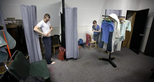Actors Justin Oho and  Heather Russell prep for their roles in Armstrong's War in a makeshift dressing rooms at the Crystal City's Parklane Theatre Thursday evening.  See Kevin Prokosh story. February 19, 2015 - (Phil Hossack / Winnipeg Free Press)