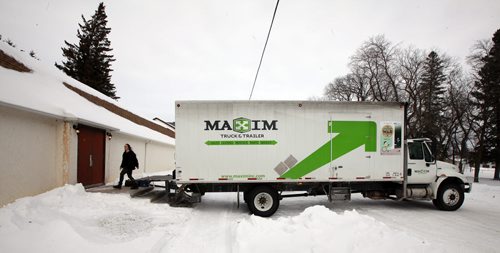 After arriving in Crystal City at the Park Lane Theatre, the company's equipment truck is backed up to the stage door to unload for their evening performance.  See Kevin Prokosh story. February 19, 2015 - (Phil Hossack / Winnipeg Free Press)
