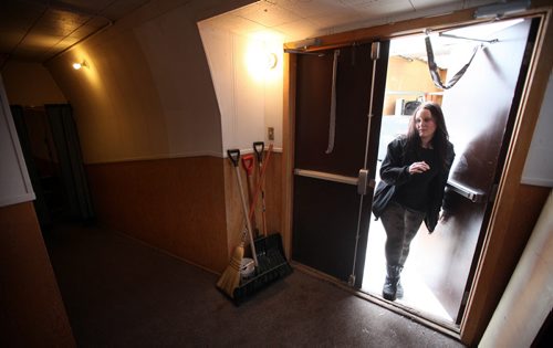 Stage Manager Kathryn Ball enters Crystal City's ParkLane Theatre, unloading set and gear for their evening performance.  See Kevin Prokosh story. February 19, 2015 - (Phil Hossack / Winnipeg Free Press)