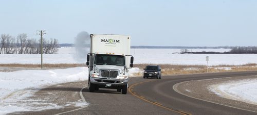 MTC's mobile production unit consiting of a van and five ton truck rolls across southern Manitoba's #3 Hwy en route to ParkLane Theatre in Crystal City for the evening performance of Armstrong's War Thursday. See Kevin Prokosh story. February 19, 2015 - (Phil Hossack / Winnipeg Free Press)