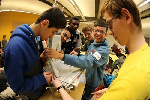 Baset Rahmani, Muhammad Abid, Daniel Isichei, Jesse Kuik, Daniel Phung and Colin Van den Akker, all grade 12 students from schools in the city, participating in a "newspaper chair challenge" as part of Science Engineering and Technology Day at the Engineering Faculty at the University of Manitoba, Friday, February 20, 2015. (TREVOR HAGAN/WINNIPEG FREE PRESS)