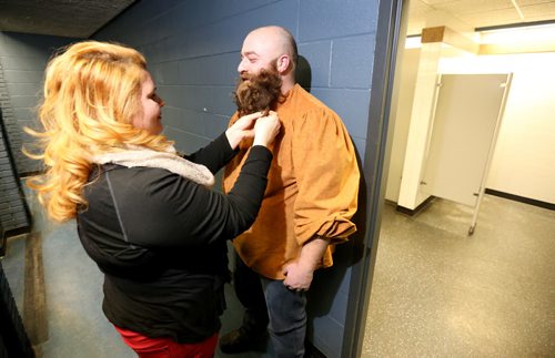 Morgan Fiks, a second time competitor, has his beard touched up by Margaret Gannon prior to the 33rd Beard Growing Contest, Friday, February 20, 2015. (TREVOR HAGAN/WINNIPEG FREE PRESS)