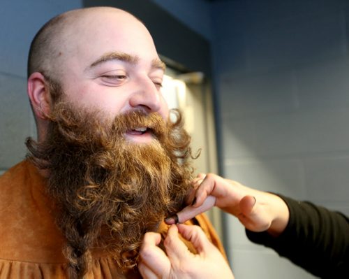 Morgan Fiks, a second time competitor, has his beard touched up by Margaret Gannon prior to the 33rd Beard Growing Contest, Friday, February 20, 2015. (TREVOR HAGAN/WINNIPEG FREE PRESS)