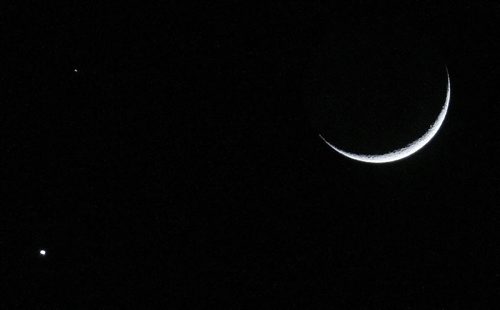 Barely a sliver of the moon is visible as it rises Friday, February 20, 2015. (TREVOR HAGAN/WINNIPEG FREE PRESS)