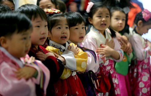 Young students from the Korean School at Grant Park, doing a last minute practice before a performance during Korean New Year celebrations, Saturday, February 21, 2015. (TREVOR HAGAN/WINNIPEG FREE PRESS)