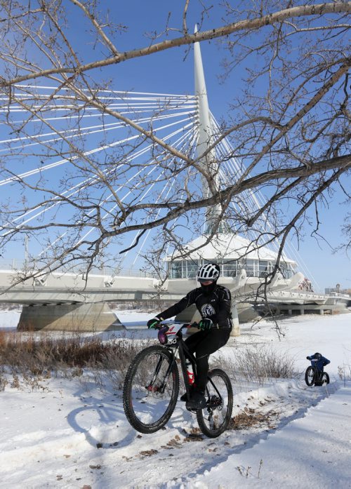 In front of the Esplanade Riel, riders prepare for the 15th annual Ice Bike event, a race on and along the Red River near The Forks, Saturday, February 21, 2015. (TREVOR HAGAN/WINNIPEG FREE PRESS)