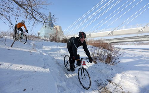 With the Canadian Museum for Human Rights and the Esplanade Riel in the background, rider prepare for the 15th annual Ice Bike event, a race on and along the Red River near The Forks, Saturday, February 21, 2015. (TREVOR HAGAN/WINNIPEG FREE PRESS)
