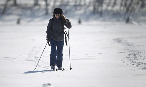 Kate Sjoberg skis along the Red River near The Forks, Saturday, February 21, 2015. (TREVOR HAGAN/WINNIPEG FREE PRESS)