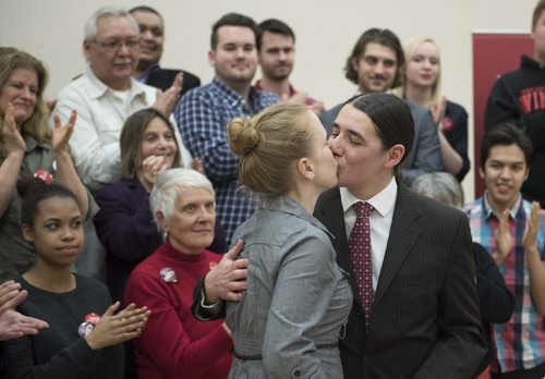 DAVID LIPNOWSKI / WINNIPEG FREE PRESS (Saturday February 21, 2015)  Robert-Falcon Ouellette kisses his wife Catherine Saturday evening at the Broadway Neighbouring Centre during a nomination meeting of the Liberal Party of Canada Winnipeg Centre Electoral District Association, where he was formally nominated as the candidate for the district.