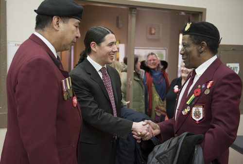 DAVID LIPNOWSKI / WINNIPEG FREE PRESS (Saturday February 21, 2015)  Robert-Falcon Ouellette greets veterans Saturday evening at the Broadway Neighbouring Centre during a nomination meeting of the Liberal Party of Canada Winnipeg Centre Electoral District Association, where he was formally nominated as the candidate for the district.