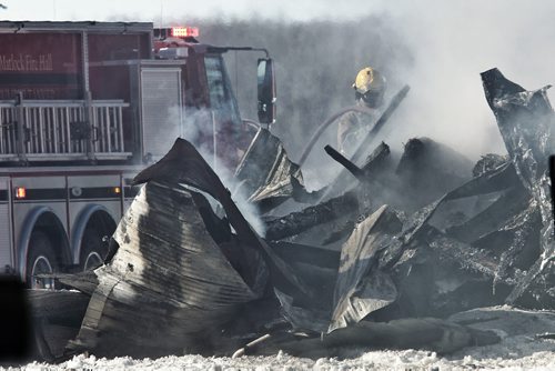 Firefighters continue to put out a barn fire at the Aesgard Ranch, located near Highway 8 in the R.M. of St. Andrews, 60 kilometres north of Winnipeg Sunday afternoon. Horses that were reported to have been housed in the now completely destroyed barn had been rescued and were not harmed by the fire.  150222 February 22, 2015 Mike Deal / Winnipeg Free Press