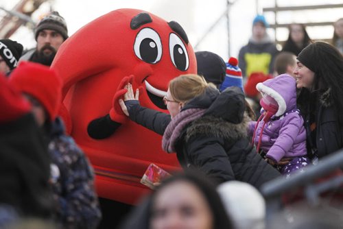 February 22, 2015 - 150222  -  Festival mascot high fives a spectator during the closing ceremony of the Festival Du Voyageur Sunday, February 22, 2015. John Woods / Winnipeg Free Press