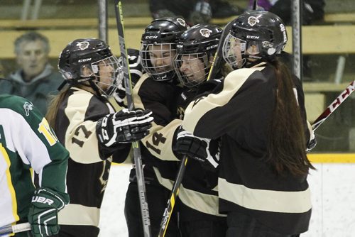 February 22, 2015 - 150222  -  Michelle Pawluk (17), Alana Serhan (14), Maggie Litchfield-Medd (15) and Erica Rieder (9) celebrate Litchfield-Medd's goal against the University of Regina Cougars in the second period of game three of the Canada West quarter-finals at the University of Manitoba Sunday, February 22, 2015. John Woods / Winnipeg Free Press