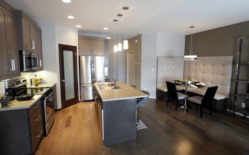 Homes.  The kitchen and dining area at right in240 Park West Drive in Bridgwater Lakes. Contact is Hilton Homes Spencer Curtis.  Todd Lewys story Wayne Glowacki/Winnipeg Free Press Feb.23   2015