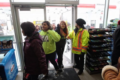 Residents from Long Plain First Nation file into the brand new Petro Canada gas station on Madison Street, Winnipeg's first urban reserve gas station.  150223 February 23, 2015 Mike Deal / Winnipeg Free Press