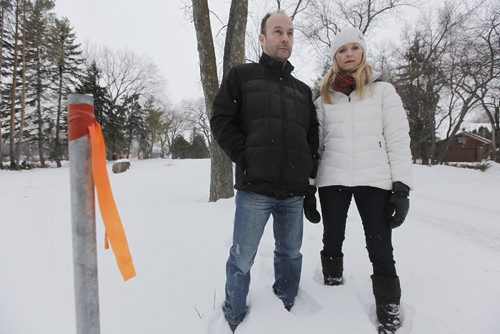 February 23, 2015 - 150223  -  Cheryl and Darrell Pakosh, photographed outside their home Monday, February 23, 2015, have spent over $50,000 fighting city hall and a developer who wants to build, next door to their home, a multi-unit condo complex on a very narrow residential lot.  The couple has already gone to court and won their suit but the developer is reapplying. John Woods / Winnipeg Free Press