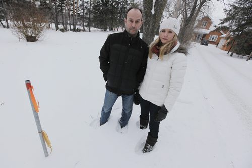 February 23, 2015 - 150223  -  Cheryl and Darrell Pakosh, photographed outside their home Monday, February 23, 2015, have spent over $50,000 fighting city hall and a developer who wants to build, next door to their home, a multi-unit condo complex on a very narrow residential lot.  The couple has already gone to court and won their suit but the developer is reapplying. John Woods / Winnipeg Free Press