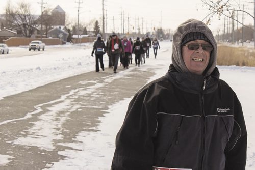 Canstar Community News Feb. 15, 2015 - Larry Fenn and others braved the cold to take part in the Winnipeg Walk for Water on Gateway this past weekend. (SUPPLIED)