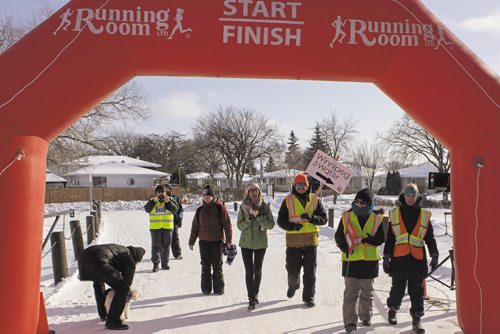 Canstar Community News Feb. 15, 2015 - Volunteers cross the finish line for the Winnipeg Walk for Water last weekend at the North Kildonan Community Centre. (SUPPLIED).