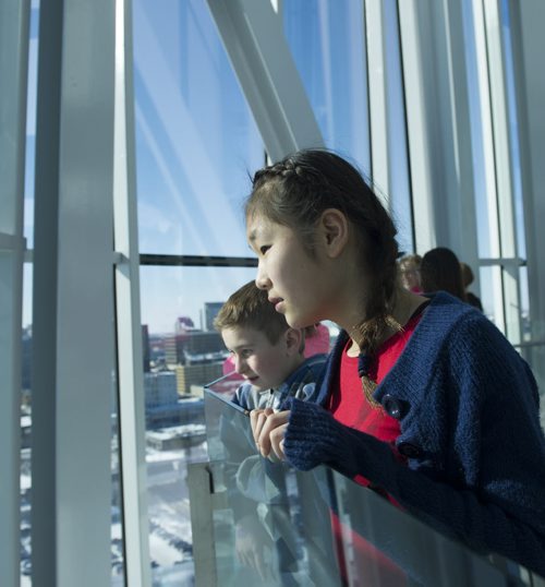 DAVID LIPNOWSKI / WINNIPEG FREE PRESS (February 25, 2015)  Darwin school student Victoria Cho looks out of the tower of hope inside of the Canadian Museum for Human Rights Wednesday afternoon as her grade 5/6 class visits the museum. More than 30 classes a week visit the museum.