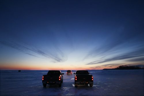 Before the sun rises ice fisherman head out on Lake Winnipeg aprx 45 km north of Winnipeg Wednesday morning to head to their ice huts to fish for walleye   Standup Photo- Feb 25, 2015   (JOE BRYKSA / WINNIPEG FREE PRESS)