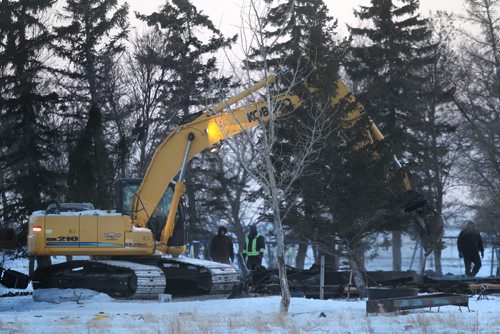 Firefighters and workers remain at the scene of a house fire that totally demolished the 2-storey home in the RM of Morris Manitoba early Wednesday morning and took the lives of four children.  See story.  Feb 25, 2015 Ruth Bonneville / Winnipeg Free Press